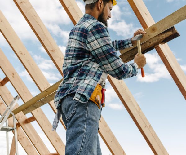 construction-worker-with-hard-hat-building-roof-house